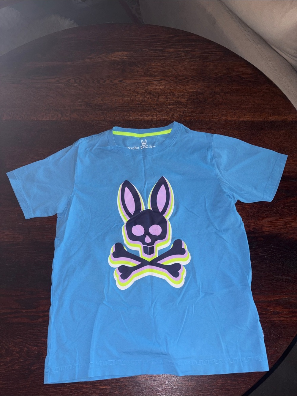 Psycho Bunny Blue Tee with Neon Bunny Skull Graphic